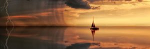 A boat floating on top of water near the ocean.