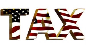 A picture of the word tax with an american flag.